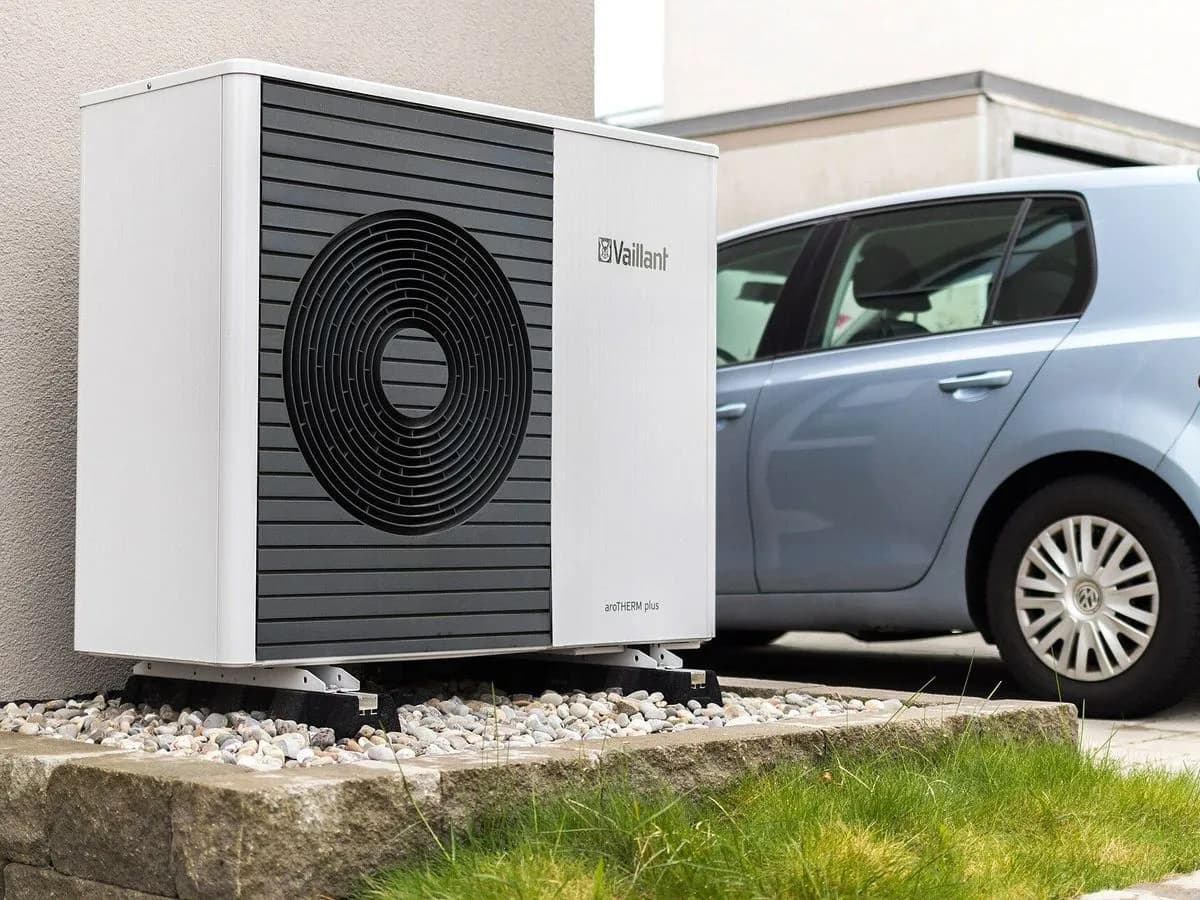 Air-to-water heat pump outdoor unit next to a house