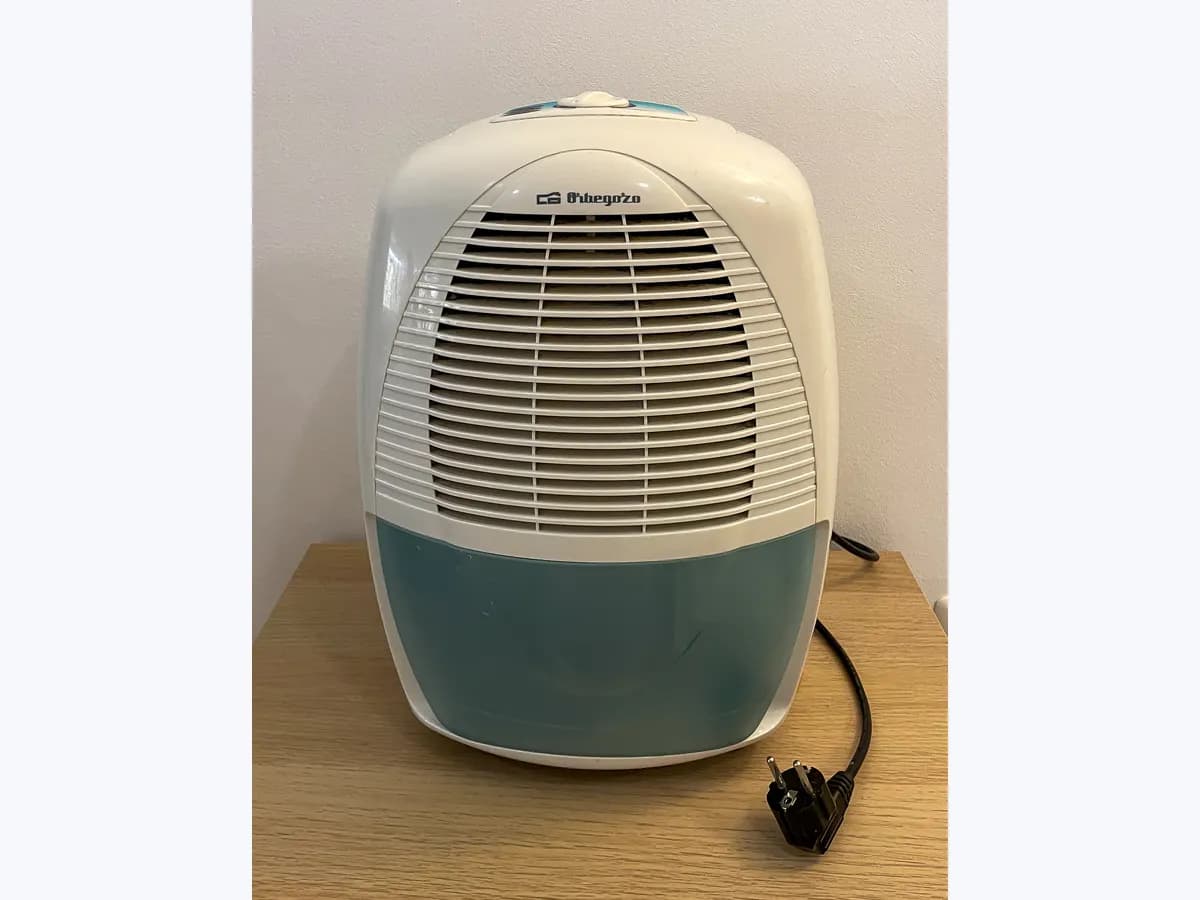 Portable home dehumidifier with front water tank and European plug