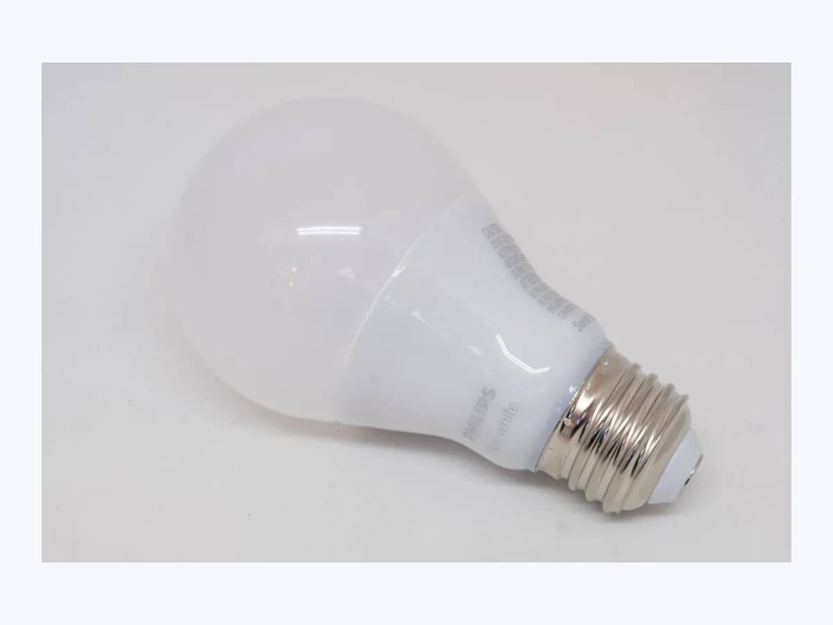 Philips Hue White smart LED bulb with screw base on a plain white background