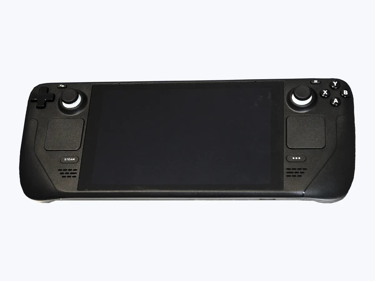 Front view of the Valve Steam Deck handheld gaming PC showing the central display, dual thumbsticks, dual trackpads, and control buttons
