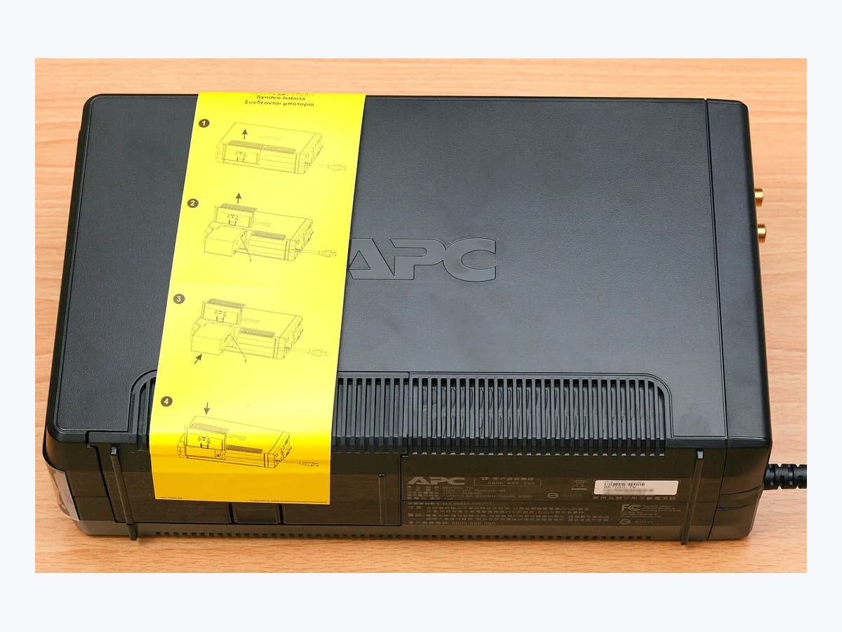 APC Back-UPS uninterruptible power supply with yellow battery label